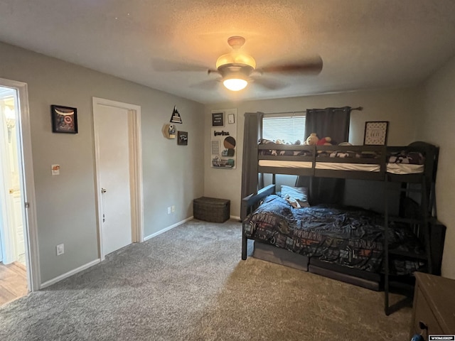 2715 Colorado Dr, Green River, WY 82935 - carpeted bedroom featuring a ceiling fan, baseboards, and a textured ceiling