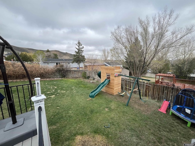 2715 Colorado Dr, Green River, WY 82935 - view of yard with a playground and a trampoline