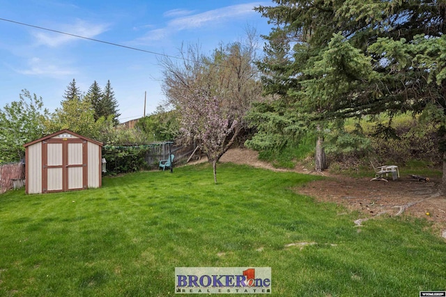 view of yard with a shed and an outbuilding