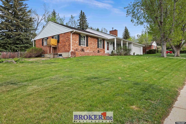 ranch-style house featuring brick siding, a garage, and a chimney