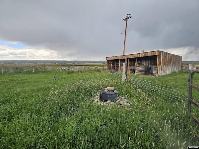 1008 N Rd 11, Worland, WY 82401 - view of yard featuring an outdoor structure, an exterior structure, and fence