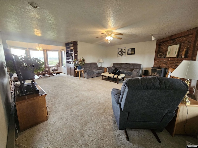 1008 N Rd 11, Worland, WY 82401 - living room featuring a textured ceiling, carpet, and ceiling fan