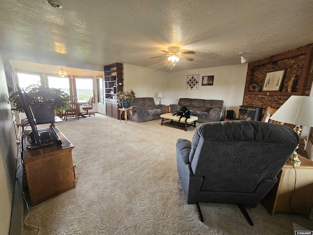 1008 N Rd 11, Worland, WY 82401 - carpeted living room featuring a textured ceiling and ceiling fan