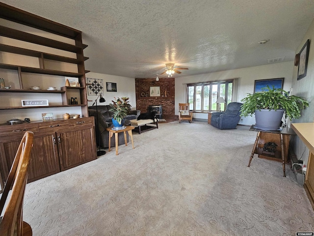 1008 N Rd 11, Worland, WY 82401 - carpeted living room featuring ceiling fan, a textured ceiling, and a fireplace