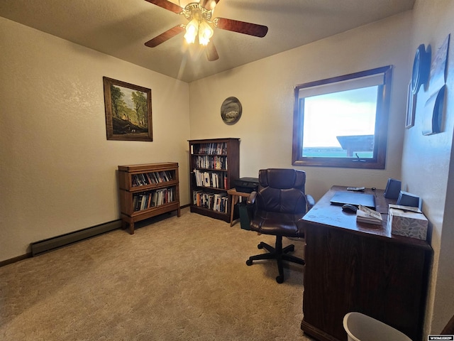 1008 N Rd 11, Worland, WY 82401 - home office featuring carpet flooring, a ceiling fan, and baseboard heating