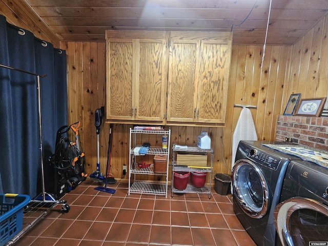 1008 N Rd 11, Worland, WY 82401 - laundry room with washing machine and dryer, wooden walls, dark tile patterned flooring, cabinet space, and wooden ceiling