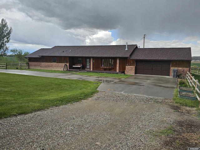 1008 N Rd 11, Worland, WY 82401 - single story home with driveway, a garage, and board and batten siding