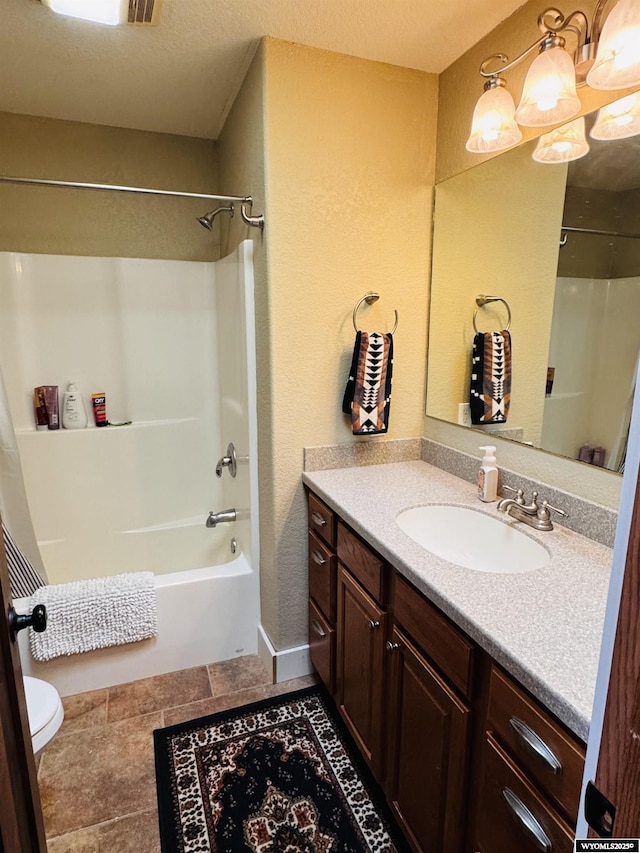101 Pebble Ln, Torrington, WY 82240 - bathroom with vanity, toilet, washtub / shower combination, and a textured wall