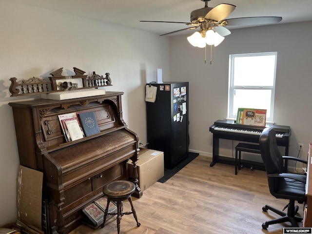 home office featuring ceiling fan and light wood finished floors