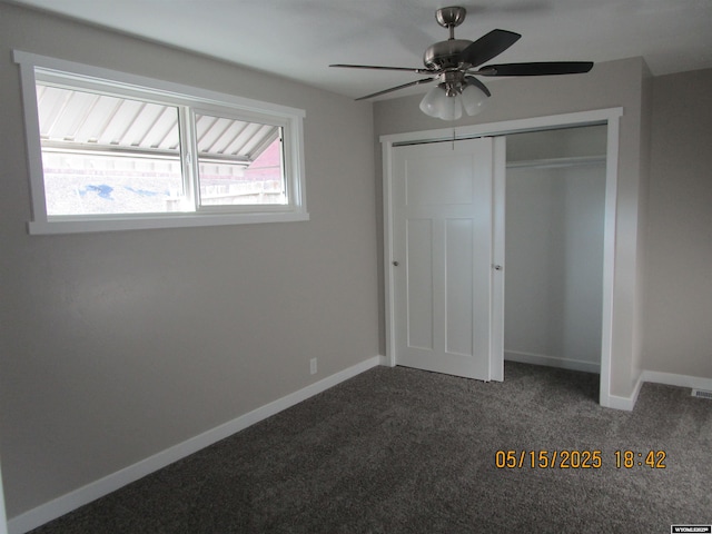 263 N 2nd Street E, St, Green River, WY 82935 - unfurnished bedroom with dark carpet, baseboards, a closet, and ceiling fan