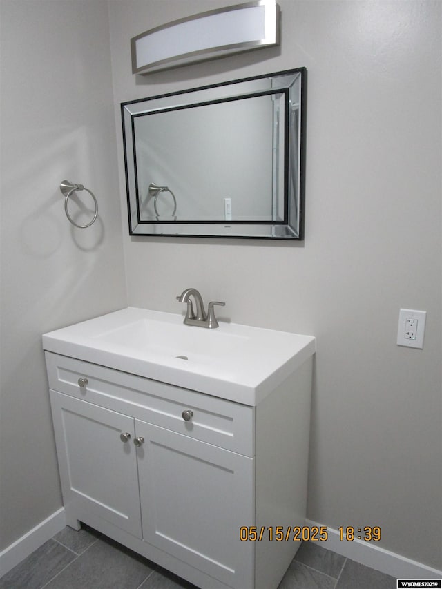 263 N 2nd Street E, St, Green River, WY 82935 - bathroom with vanity, baseboards, and tile patterned flooring