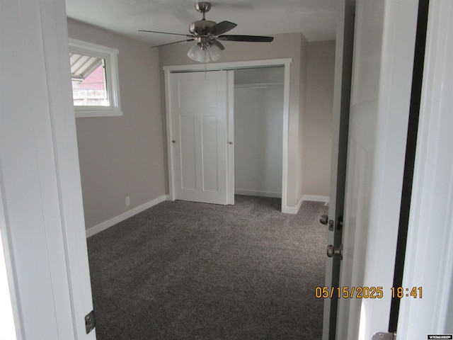 263 N 2nd Street E, St, Green River, WY 82935 - unfurnished bedroom featuring dark colored carpet, baseboards, a closet, and ceiling fan