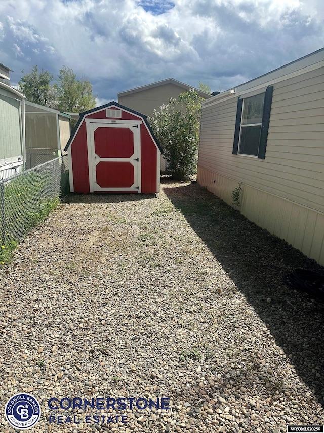 view of shed with fence