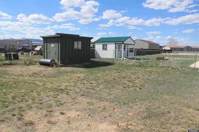 7 N Schmid Dr, La Barge, WY 83123 - view of yard featuring a storage shed, an outdoor structure, and a residential view