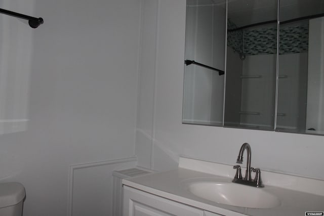 7 N Schmid Dr, La Barge, WY 83123 - bathroom featuring vanity, toilet, and a shower