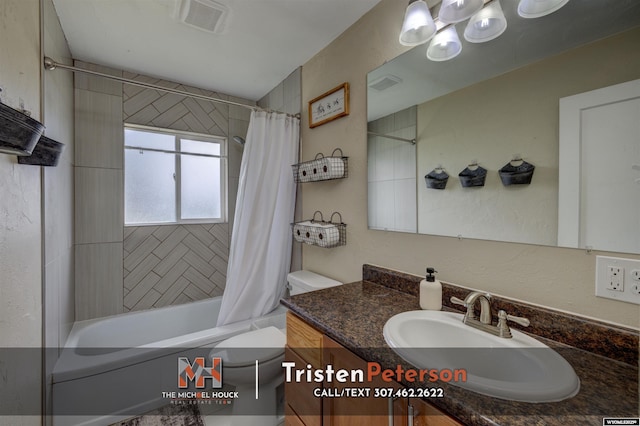 2819 E 6th St, Casper, WY 82609 - bathroom featuring toilet, vanity, and shower / tub combo