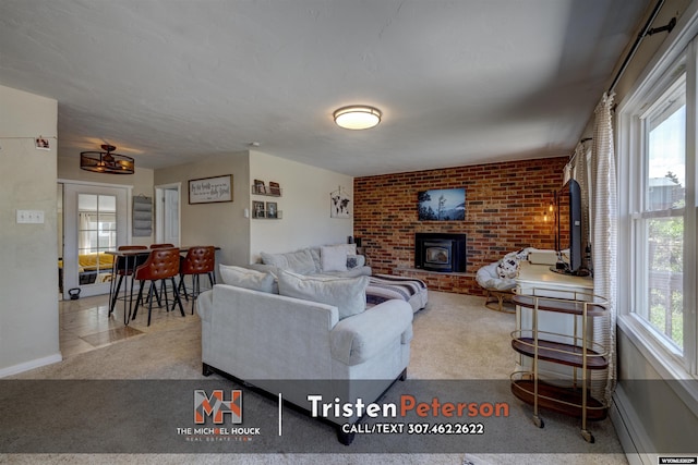 2819 E 6th St, Casper, WY 82609 - carpeted living room featuring a brick fireplace, brick wall, and baseboards