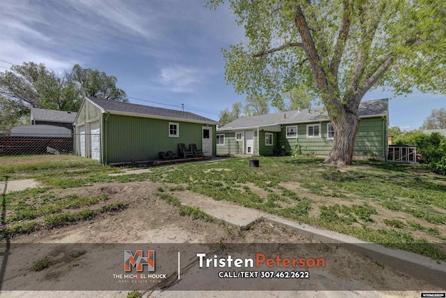 2819 E 6th St, Casper, WY 82609 - view of front of home with an outbuilding, fence, and a garage
