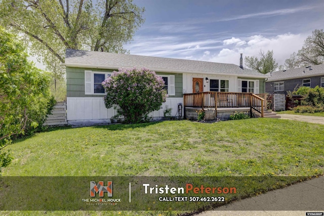 2819 E 6th St, Casper, WY 82609 - view of front of home featuring a wooden deck and a front yard
