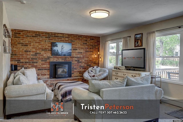 2819 E 6th St, Casper, WY 82609 - living room with a wood stove, brick wall, and baseboard heating