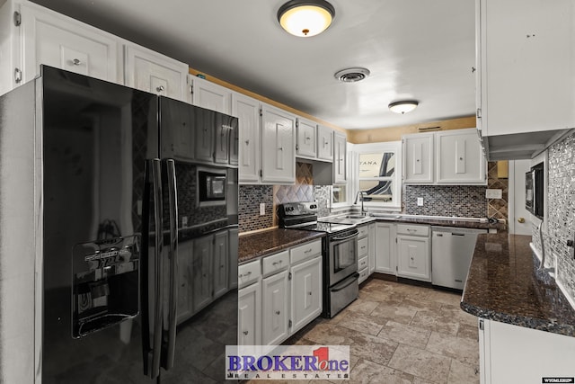 kitchen featuring appliances with stainless steel finishes, white cabinets, and decorative backsplash