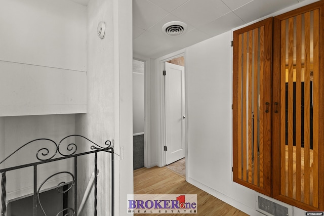 hallway with wood finished floors