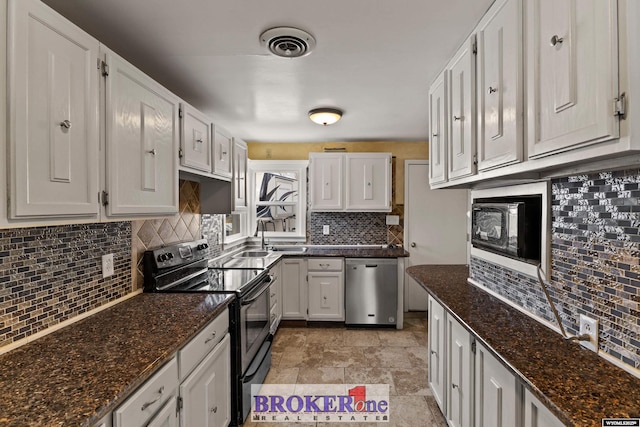 kitchen featuring range with electric cooktop, stainless steel dishwasher, decorative backsplash, and white cabinetry