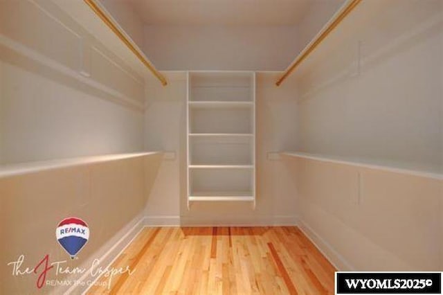 spacious closet featuring wood finished floors