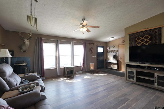 33 Oxbow Rd, Buffalo, WY 82834 - living room with a textured ceiling, ceiling fan, wood finished floors, and baseboards