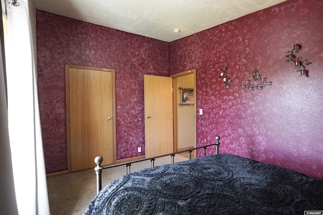 33 Oxbow Rd, Buffalo, WY 82834 - bedroom with carpet flooring and wallpapered walls