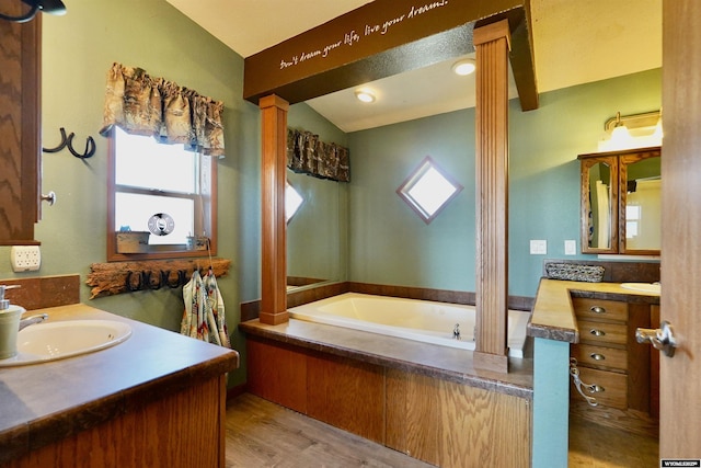 33 Oxbow Rd, Buffalo, WY 82834 - full bath featuring plenty of natural light, vanity, ornate columns, lofted ceiling, and a bath