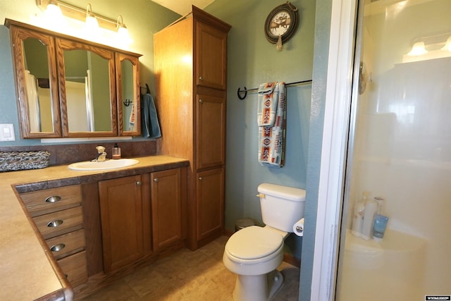 33 Oxbow Rd, Buffalo, WY 82834 - bathroom featuring walk in shower, toilet, and vanity