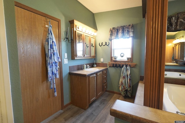 33 Oxbow Rd, Buffalo, WY 82834 - full bathroom featuring wood finished floors and vanity