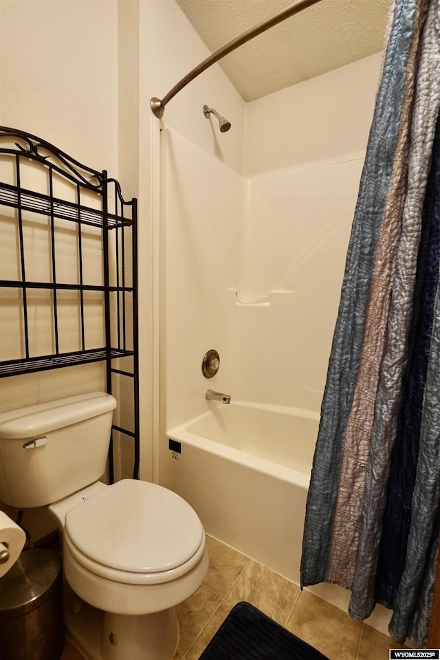 33 Oxbow Rd, Buffalo, WY 82834 - bathroom with tile patterned floors, toilet, and shower / bathtub combination with curtain