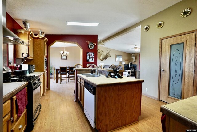 33 Oxbow Rd, Buffalo, WY 82834 - kitchen featuring gas range oven, white dishwasher, a sink, light wood-type flooring, and black microwave