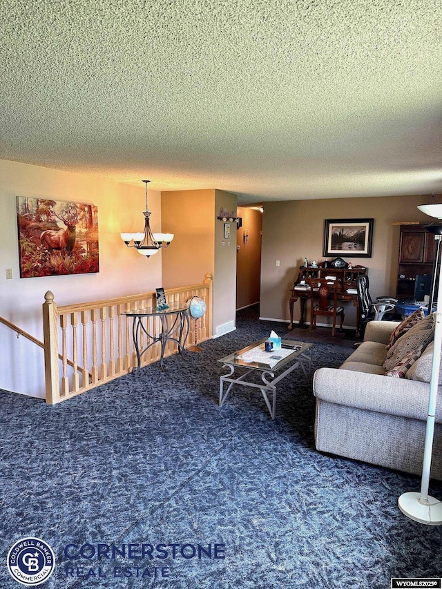 carpeted living room with a textured ceiling and a chandelier