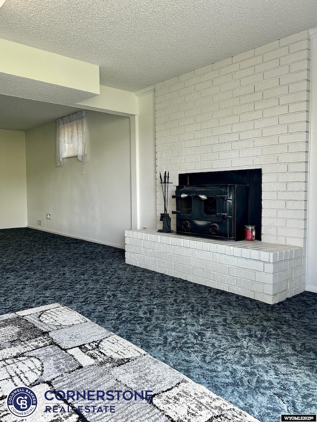 living room with carpet flooring, a brick fireplace, and a textured ceiling