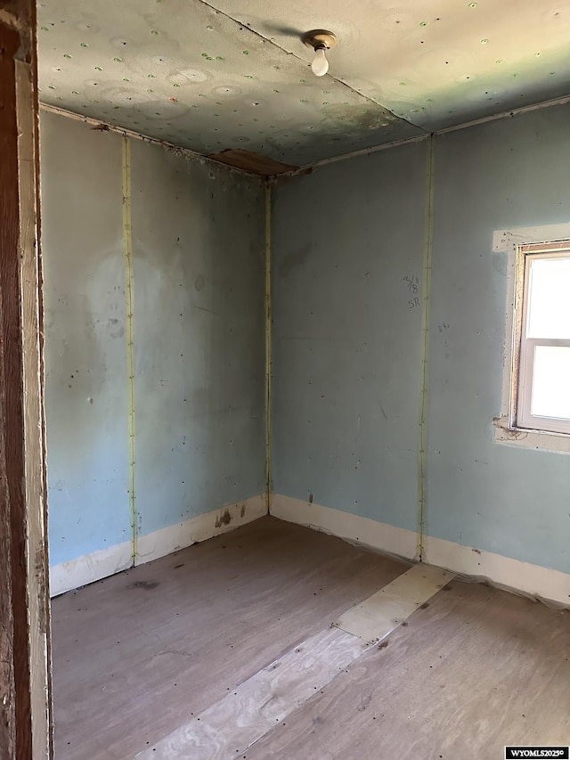 107 S Laramie Ave, Fort Laramie, WY 82212 - empty room featuring wood finished floors and baseboards