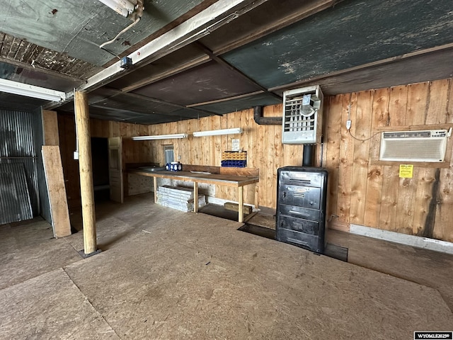 107 S Laramie Ave, Fort Laramie, WY 82212 - unfinished basement with an AC wall unit and wooden walls