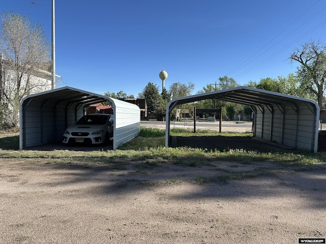 107 S Laramie Ave, Fort Laramie, WY 82212 - view of vehicle parking with a carport and driveway