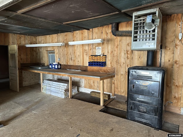 107 S Laramie Ave, Fort Laramie, WY 82212 - below grade area featuring a workshop area and wood walls