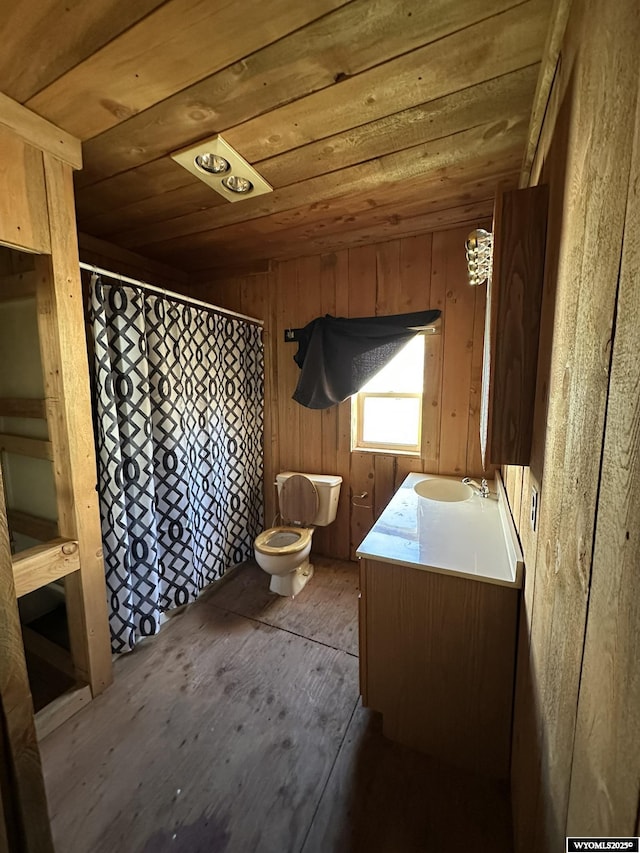 107 S Laramie Ave, Fort Laramie, WY 82212 - full bathroom with wooden ceiling, toilet, hardwood / wood-style flooring, vanity, and a shower with shower curtain