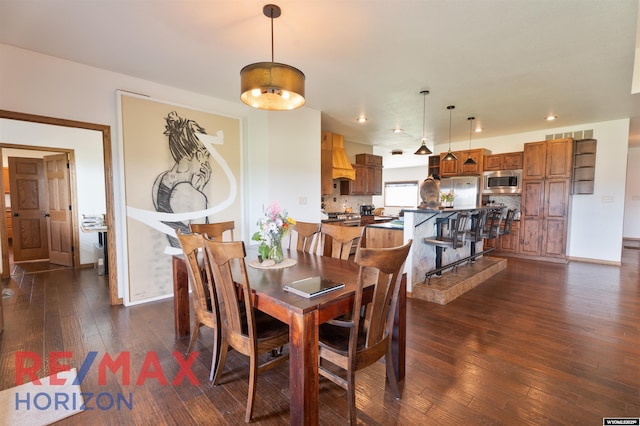 6 Chapparal, Douglas, WY 82633 - dining area featuring dark wood finished floors, recessed lighting, and baseboards