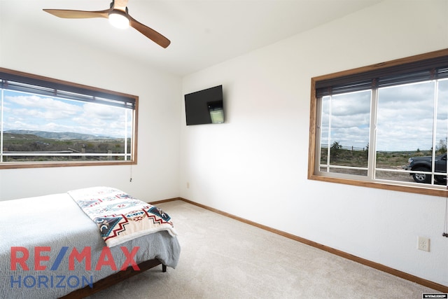 6 Chapparal, Douglas, WY 82633 - bedroom with light colored carpet, baseboards, and ceiling fan