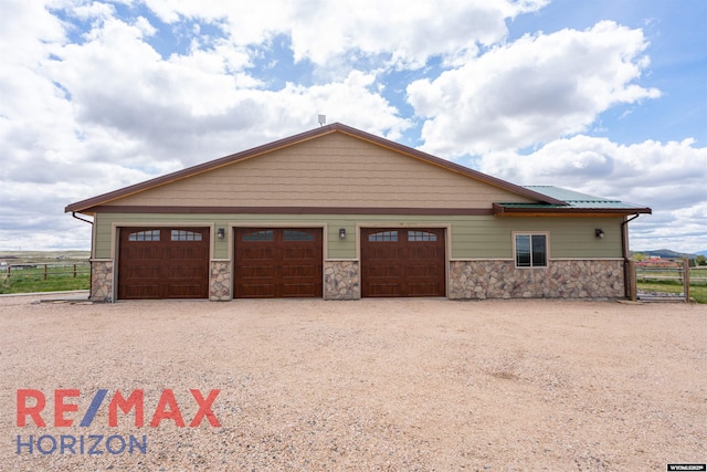 6 Chapparal, Douglas, WY 82633 - view of front of house featuring stone siding and driveway