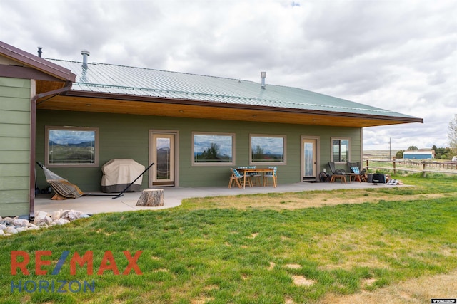 6 Chapparal, Douglas, WY 82633 - back of property featuring a patio and metal roof