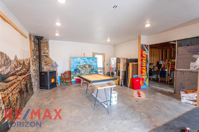 6 Chapparal, Douglas, WY 82633 - garage featuring a wood stove and recessed lighting