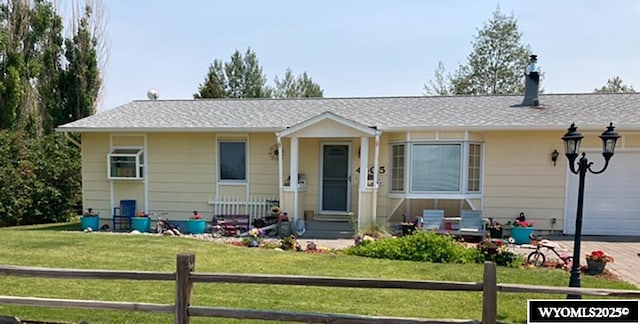 ranch-style house with a garage and driveway