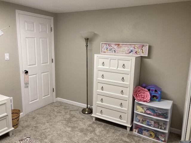 carpeted bedroom featuring baseboards