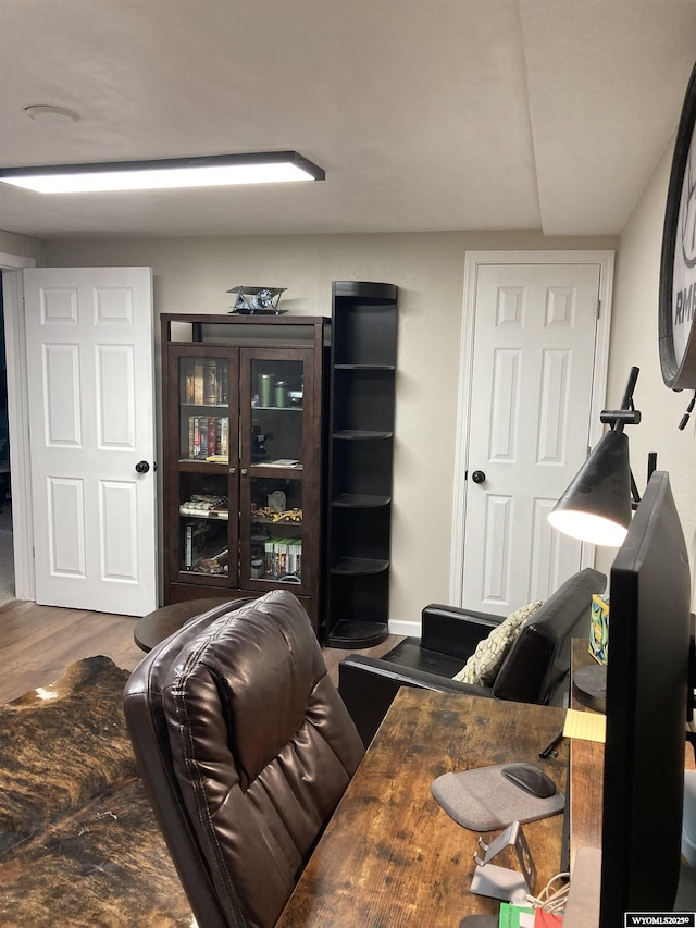 home office with wood finished floors